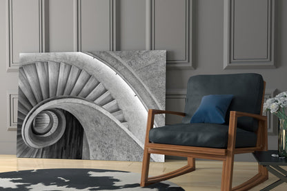 Monochromatic architectural glass wall art featuring a spiral staircase detail displayed in a modern interior with mid-century furniture.