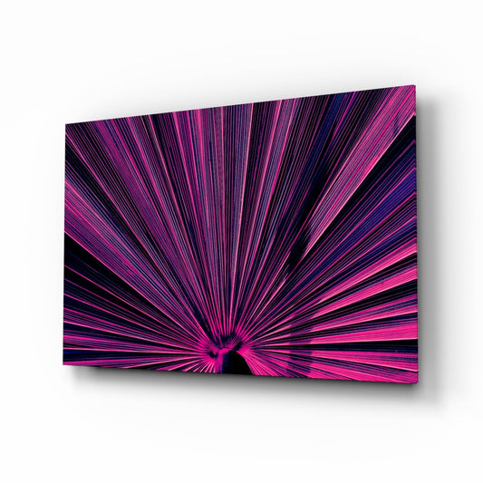 Vibrant pink and purple radiating lines converge at center on glossy glass panel against white background.