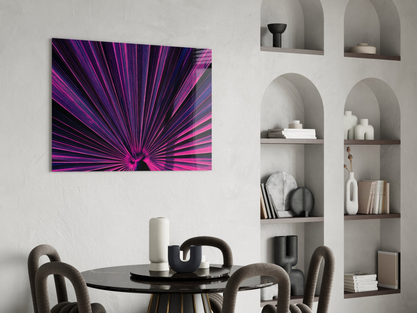 Vibrant purple and pink radial burst glass art panel hung above a modern dining room with round table and curved chairs.