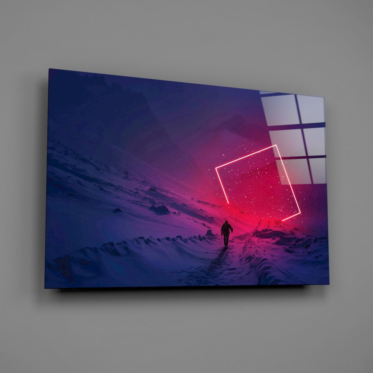 Glass wall art mounted on gray wall displaying neon-outlined geometric shapes over a desert landscape with solitary figure and pink-purple gradient sky.