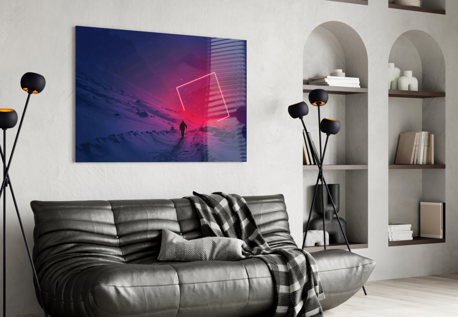 Modern living room with neon-lit glass artwork depicting purple sunset and silhouetted figure mounted above gray leather sofa.