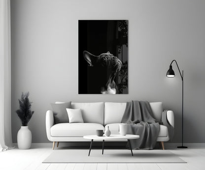 Black and white French Bulldog glass wall art displayed above a white sofa in a minimalist living room setting.
