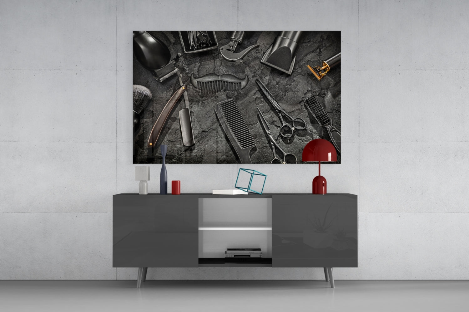 Modern living room with dark gray media console displaying barber tools glass wall art above, flanked by red and white decorative accessories.