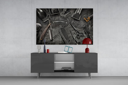 Modern living room with dark gray media console displaying barber tools glass wall art above, flanked by red and white decorative accessories.