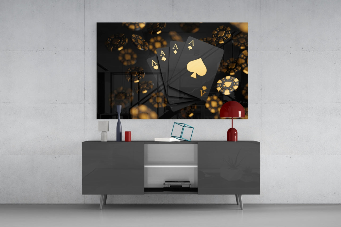 Black glass wall art featuring four golden aces and a spade symbol displayed above a gray media console.