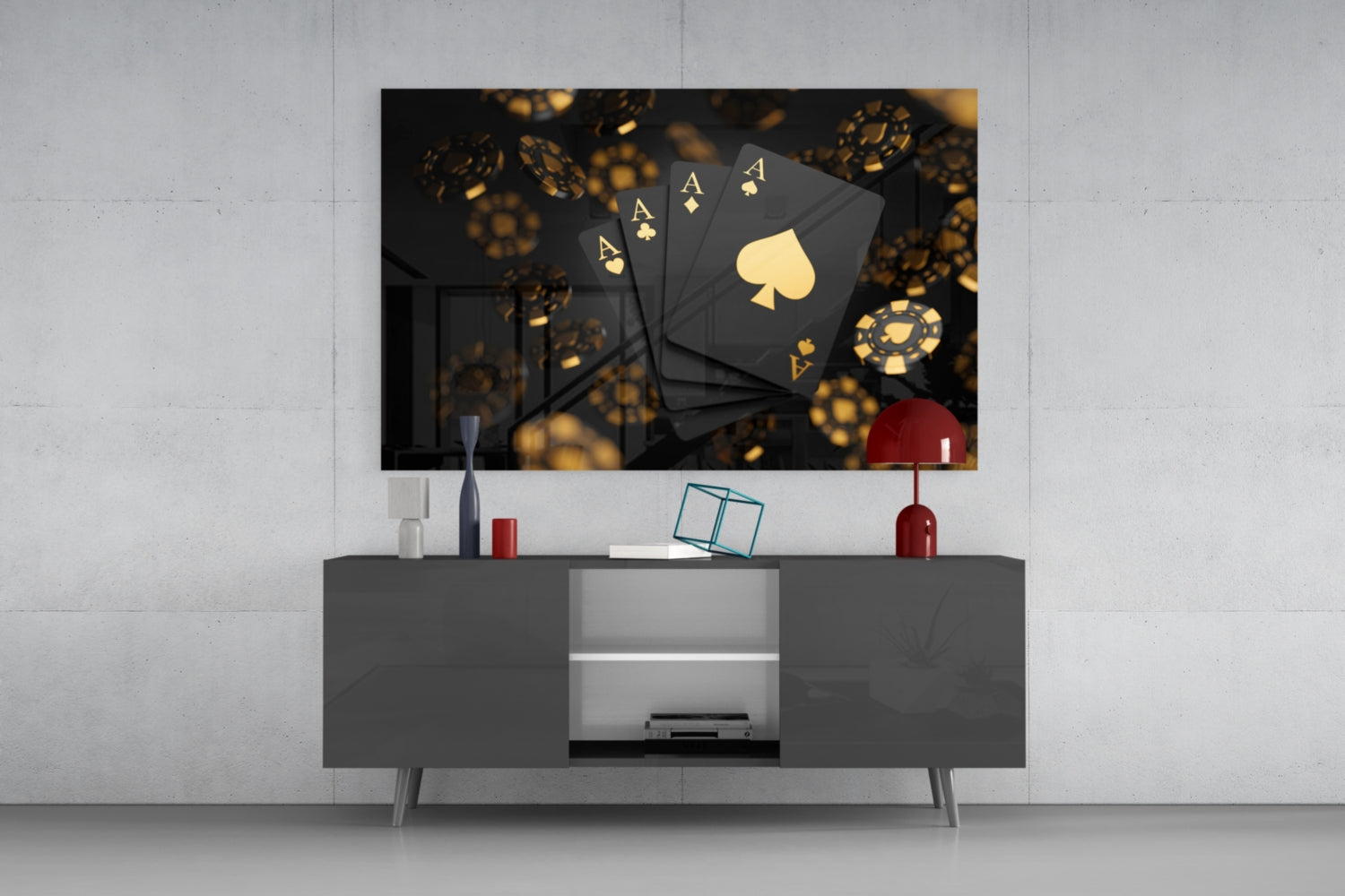 Black glass wall art featuring four golden aces and a spade symbol displayed above a gray media console.
