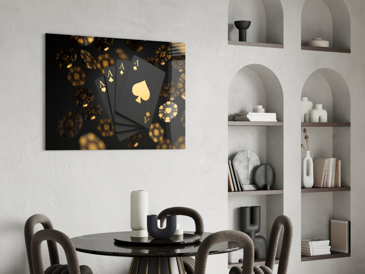 Black glass wall art with gold playing cards and poker chips displayed above a dining table in a modern interior.