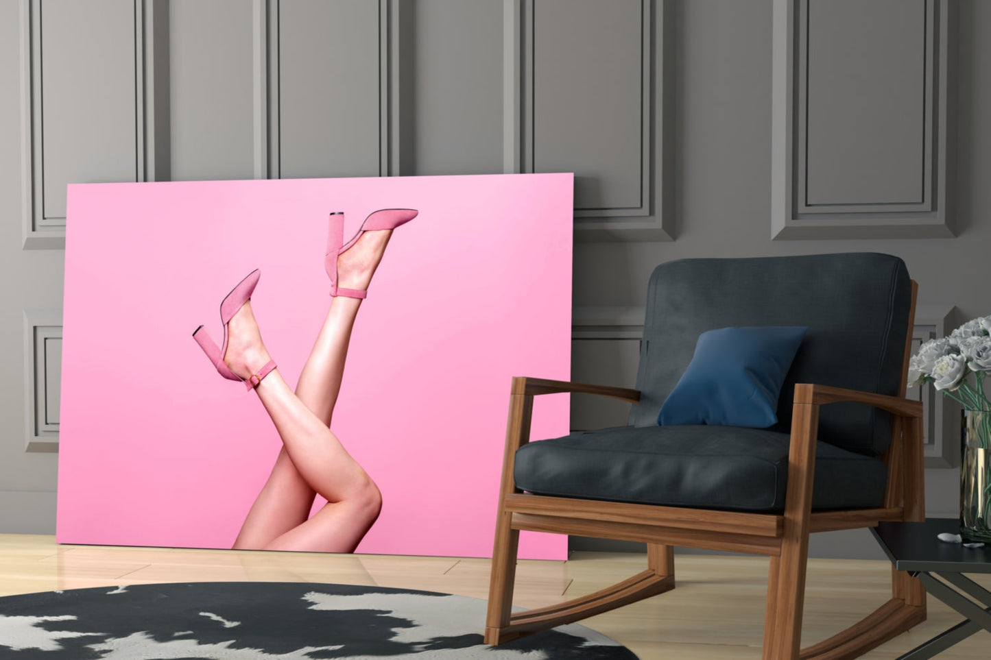 Pink glass wall art featuring legs in pink heels displayed in modern living room with wooden chair.