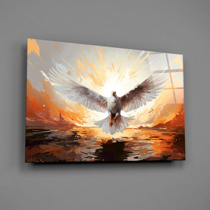 Glass wall art panel depicting a white dove with spread wings ascending toward golden light above an orange desert landscape with dark water reflections below.