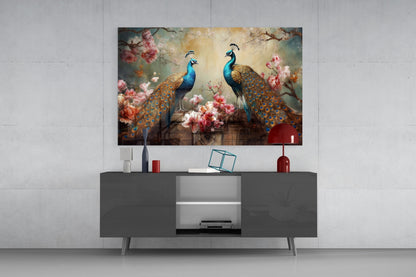 Peacock glass wall art displayed above a dark grey media console, showing three peacocks among pink flowers against a golden background.