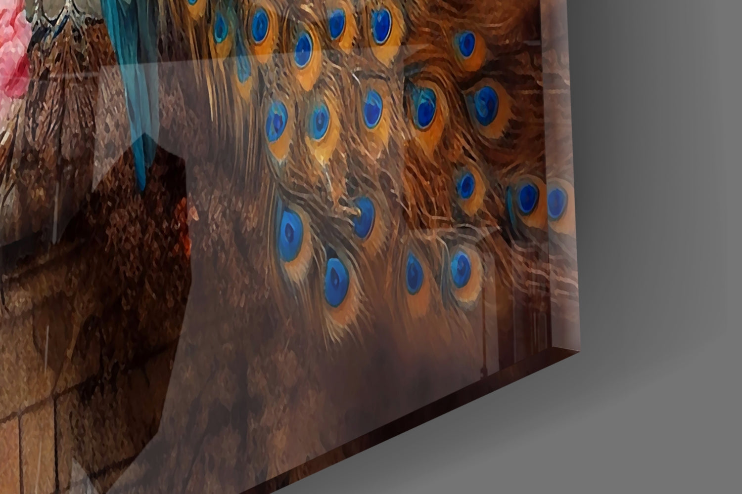 Close-up angle of peacock glass wall art showing brown feathers with vibrant blue eye-spot details and gold accents.