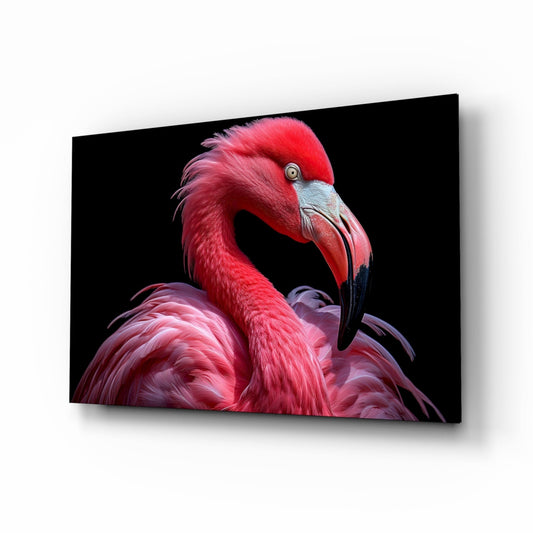 Vivid pink flamingo with red plumage and blue-gray facial markings on black glass wall art, displayed at three-quarter angle.