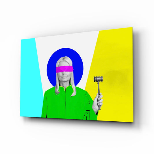 Angled front view of glass wall art featuring a black and white photograph of a woman with a magenta eye stripe and green jacket, set against cyan, blue, and yellow geometric background.