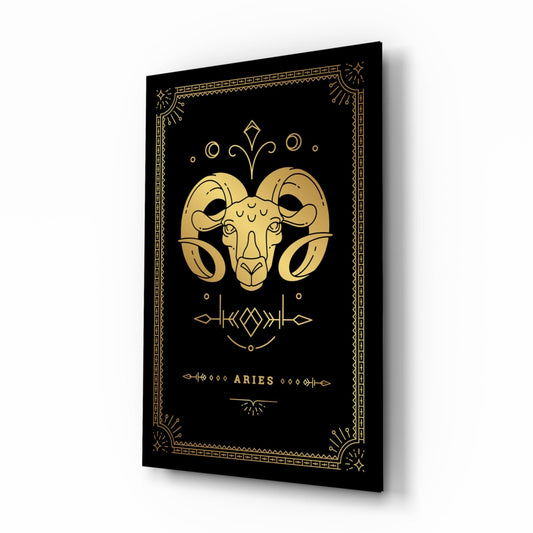 Black glass wall art panel with gold ram head design and "ARIES" text, displayed at an angle showing depth and shadow.