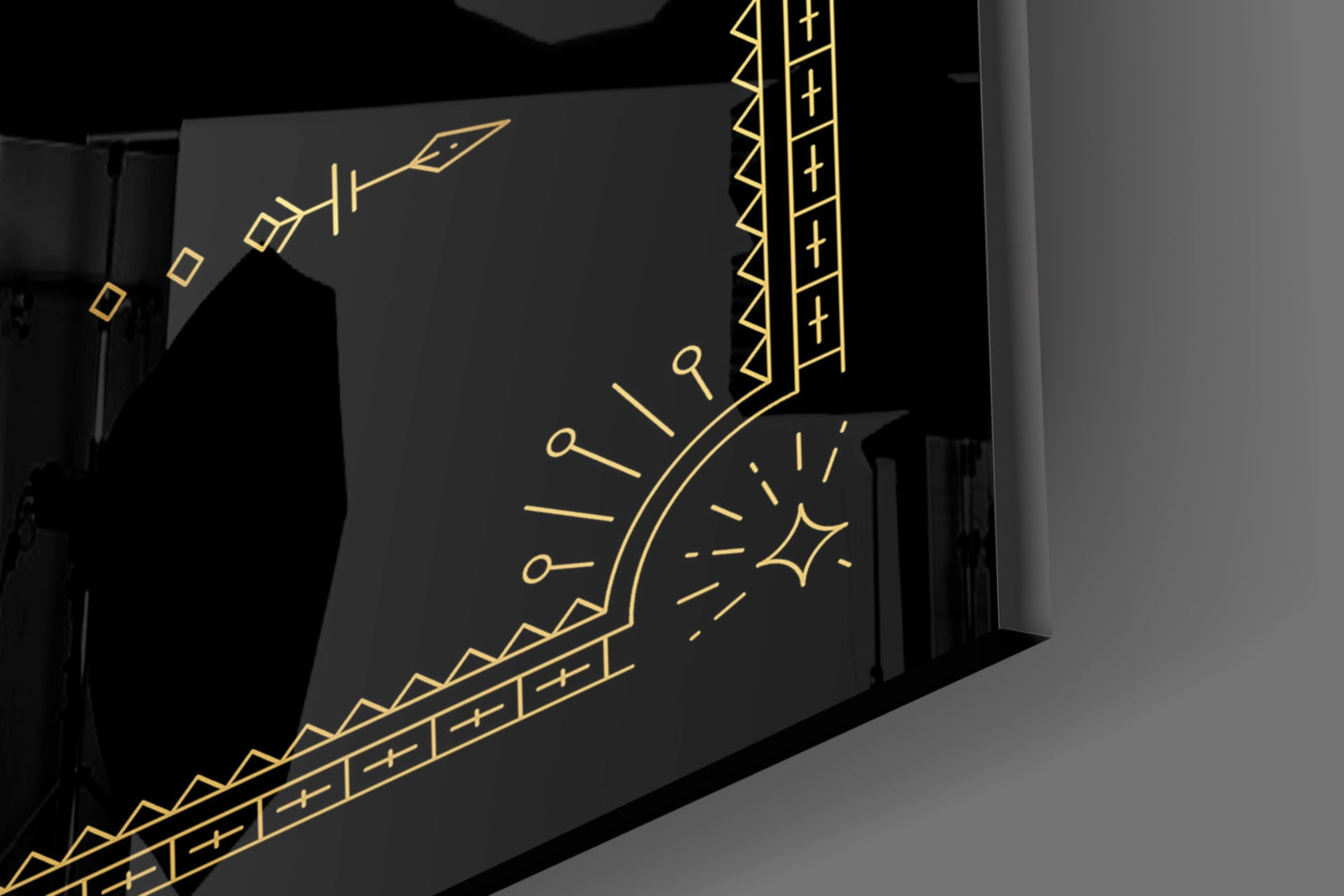 Black glass wall art with gold line-drawn Gemini twins symbol, decorative borders, and geometric patterns displayed at an angle.