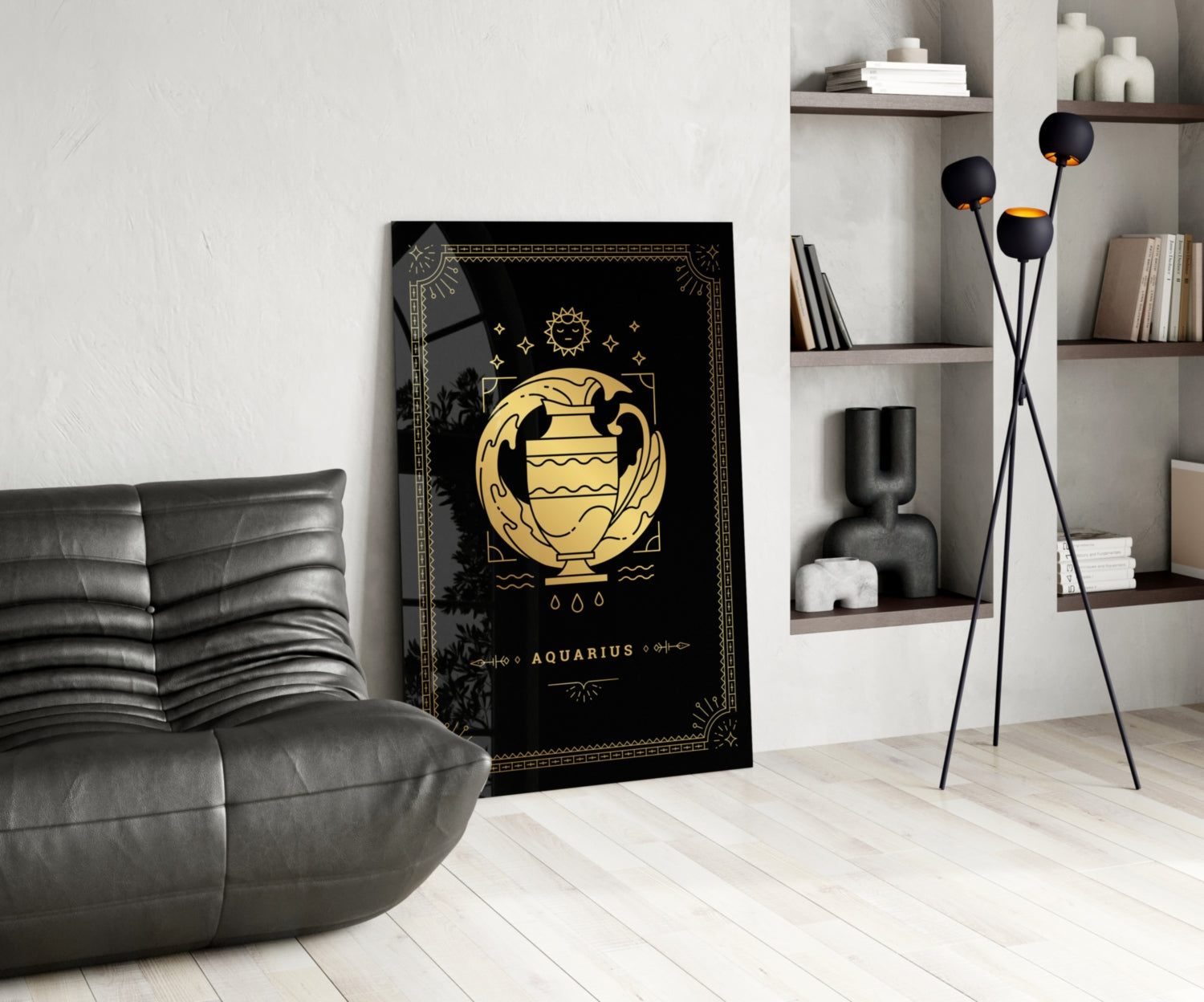 Black glass Aquarius zodiac wall art with gold urn illustration displayed in modern living room with gray chair and shelving.