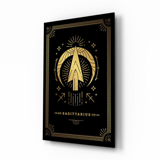 Black glass wall art with gold Sagittarius zodiac symbol, archer illustration, celestial decorative border, and text on angled perspective view.