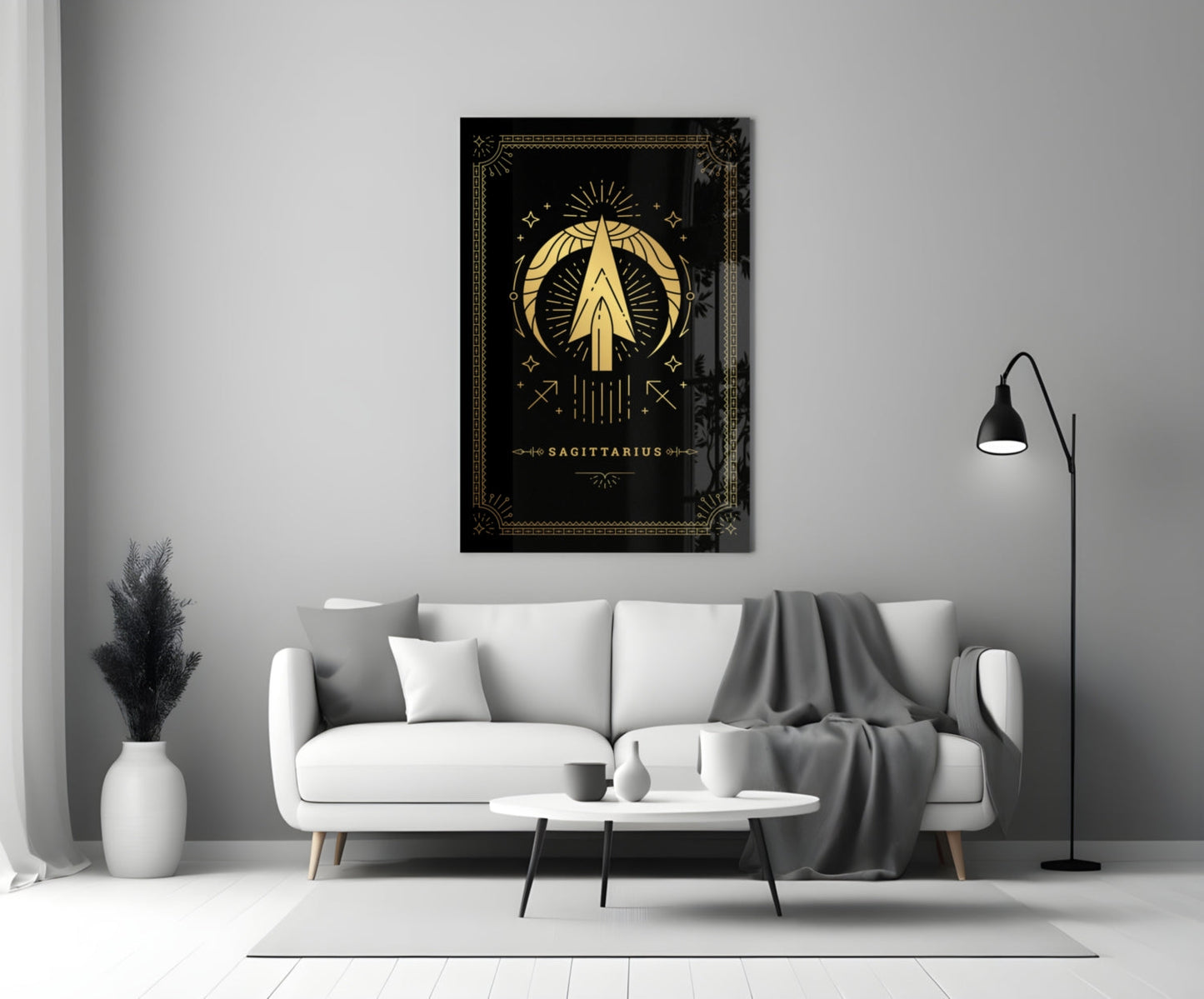 Black glass Sagittarius zodiac wall art with gold celestial design displayed above white sofa in modern living room.