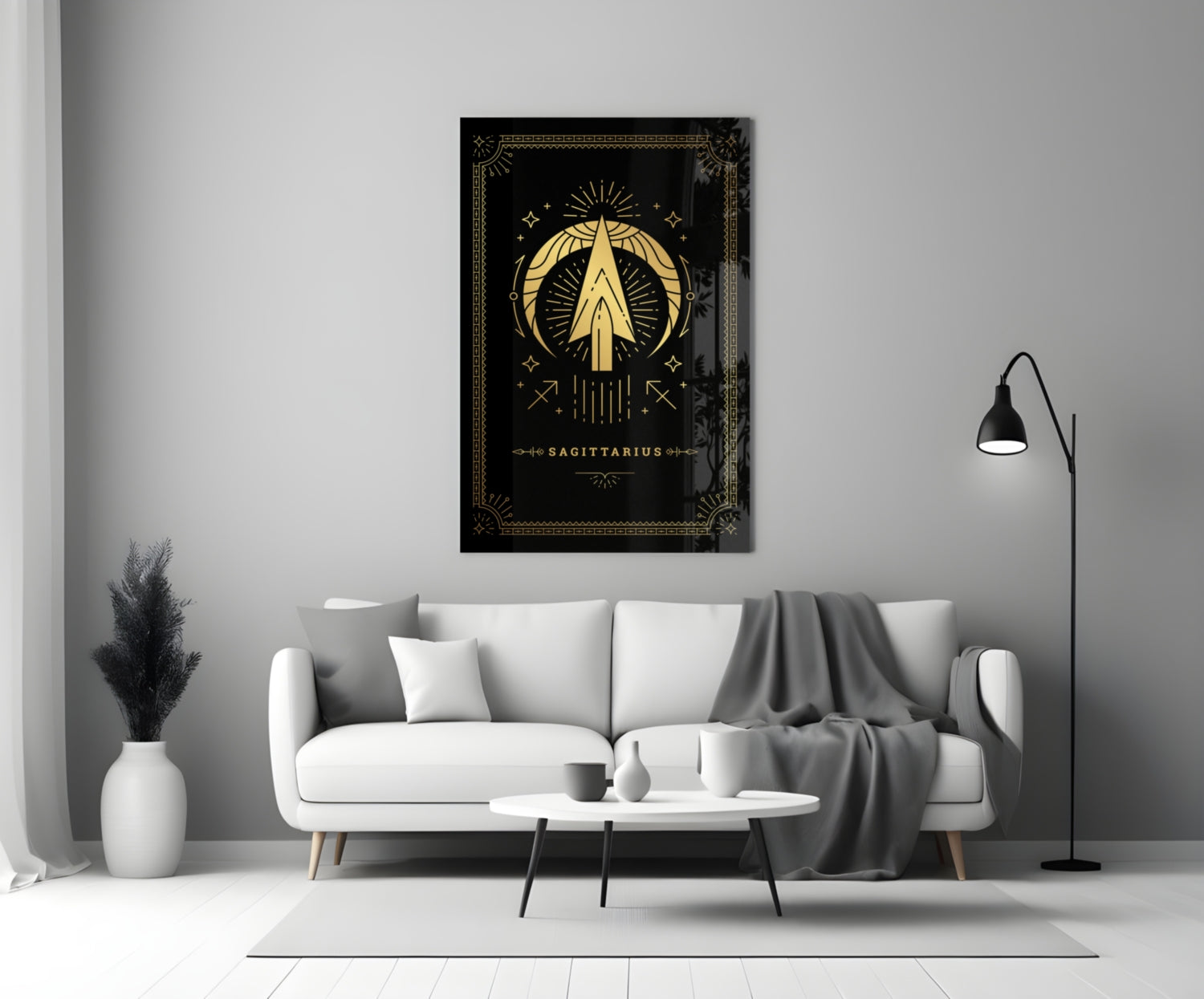 Black glass Sagittarius zodiac wall art with gold celestial design displayed above white sofa in modern living room.