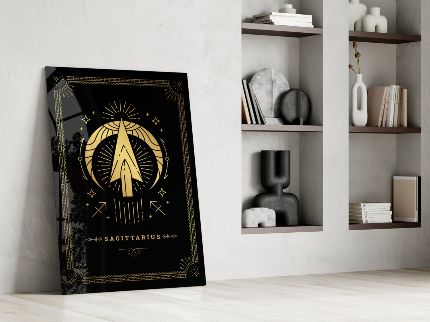 Black glass Sagittarius tarot card art leaning against white wall beside wooden shelving with decorative objects and books.