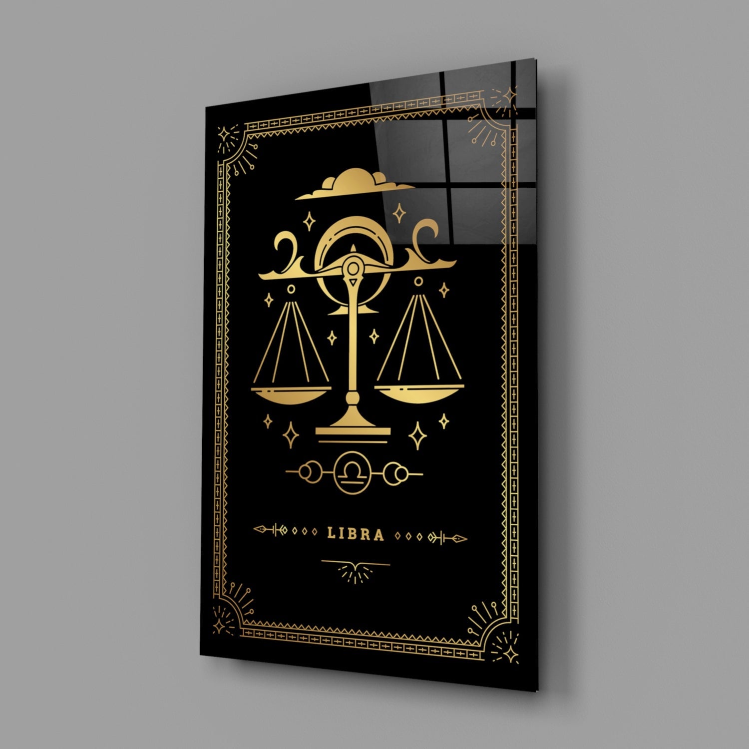 Black glass wall art featuring gold Libra scales symbol with decorative border and "LIBRA" text, displayed at an angle.