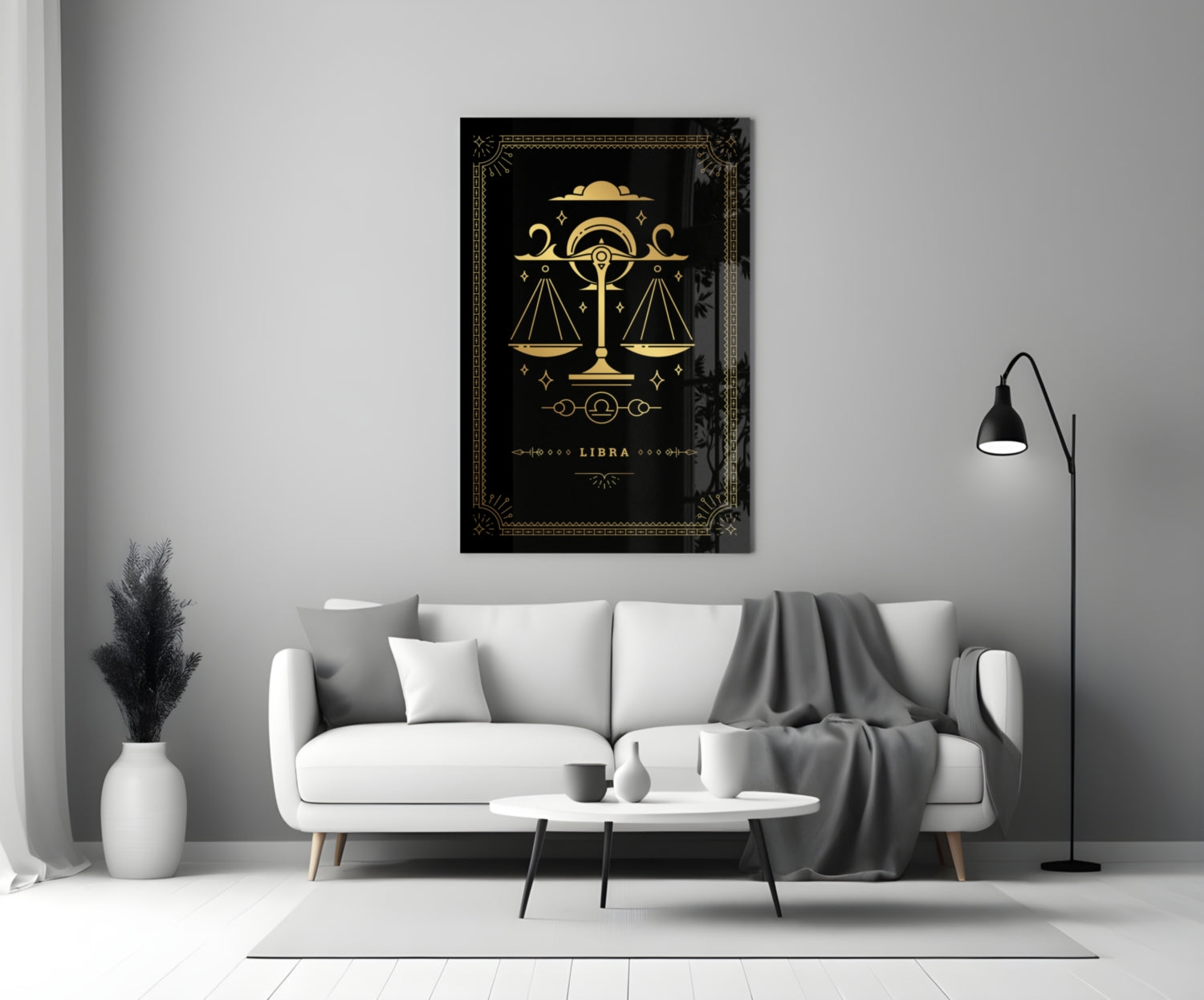 Black glass Libra zodiac wall art with gold scales and decorative borders displayed above a white sofa in a modern living room.
