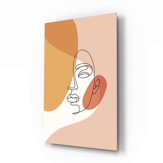 Three-dimensional view of glass wall art featuring a minimalist line-drawn face with orange and golden abstract shapes on a neutral beige background.