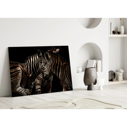 Stunning black-and-white zebras in intimate pose on glass wall art