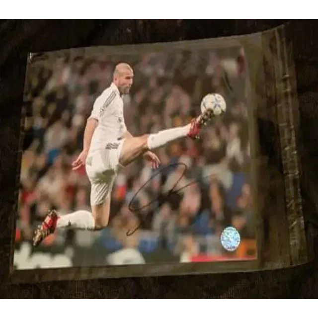 Autographed Zinedine Zidane signed 8x10 photograph of him performing a volley kick