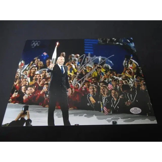 Zinedine Zidane Signed Torch 8x10 Photo Olympic Collectible featuring man with torch