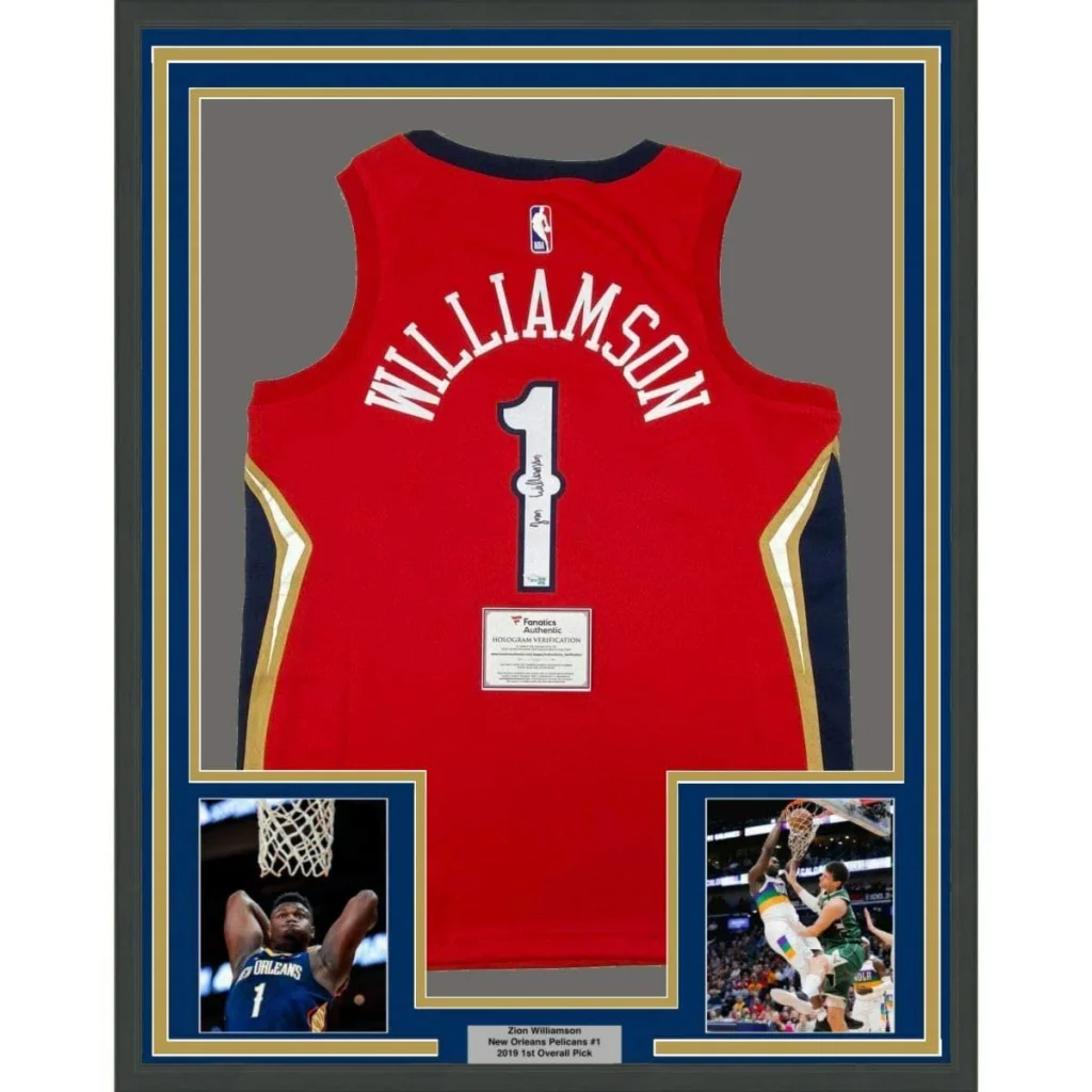 Framed Zion Williamson Signed Pelicans Jersey with action shots and plaque ready to hang